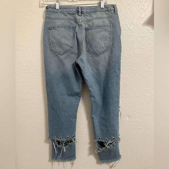Jeans are cropped at the ankle and wide in the waist. - Picture 2 of 9